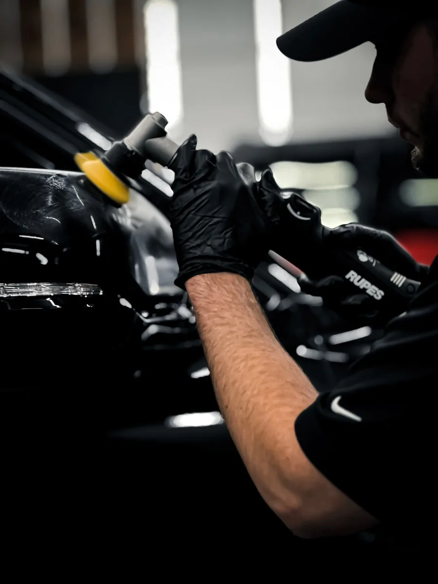 Paint correction tech from car detailing service